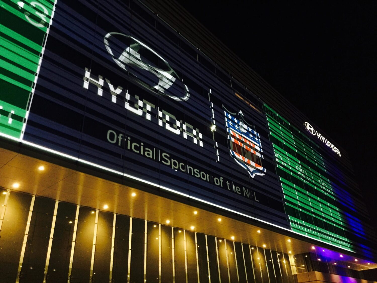 Closer view of projection mapping on Hyundai building for NFL