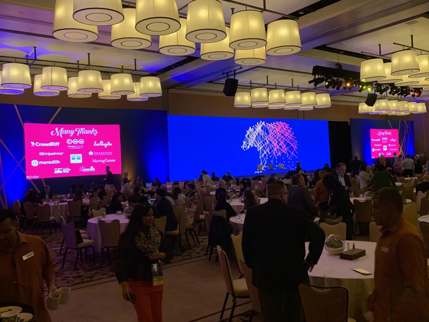 Image of a group meeting in a large vibrant room.