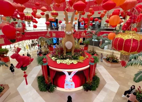 Image of Lunar New Year display of rabbit sitting atop a LED Screen