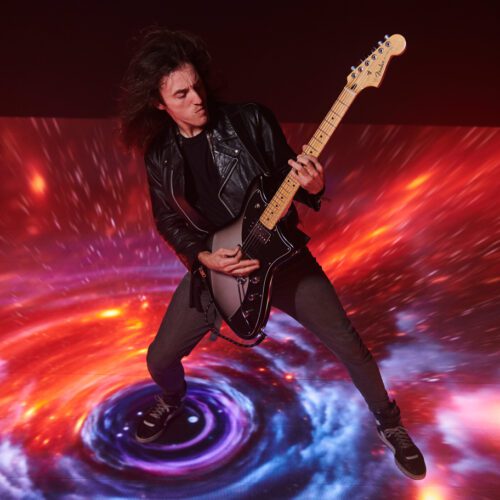 Image of guitarist performing on LED floor